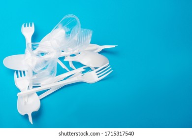 Social Environmental Issue. Plastic Pollution Of The Planet. White Plastic On A Blue Background. Ecological Catastrophy. Sorting And Processing Of A Stick. Plastic Waste In The Environment.Eco-problem