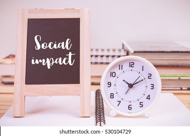 Social Impact On Blackboard And Clock With Vintage Color Effected