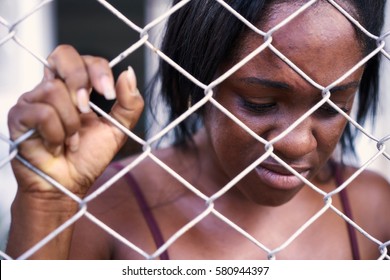 Social issues, abuse and violence on women. Depressed girl, sad african american young woman crying at home. Abused and scared wife