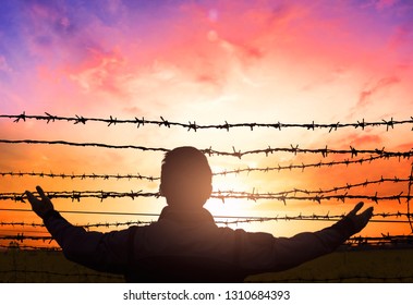 Social Justice Abstract Concept: With Blurry Barbed Wire Rod Fence