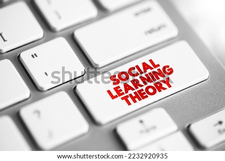 Social learning theory - learning process and social behavior which proposes that new behaviors can be acquired by observing and imitating others, text concept button on keyboard
