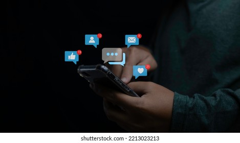 Social media and digital online on mobile phone. man using smartphone with social media to interactions icon on internet post. Data and marketing concept. - Powered by Shutterstock