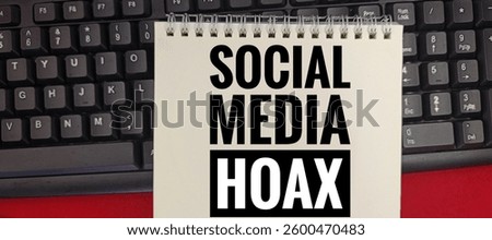 Social Media Hoax written on a notebook placed on a keyboard, symbolizing misinformation, fake news, online deception, digital fraud, and the spread of false information in the internet age.