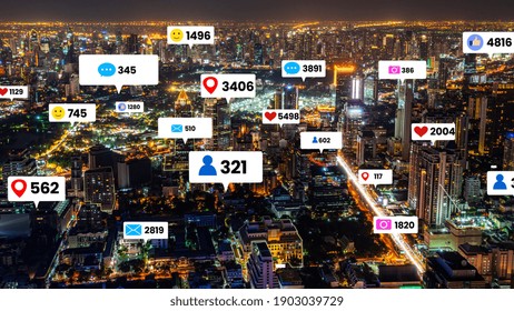 Social Media Icons Fly Over City Downtown Showing People Engagement Connection Through Social Network Application Platform . Concept For Online Community And Social Media Marketing Strategy .