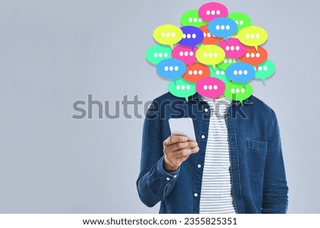 Social media, man and speech bubble with phone in studio, gray background and overlay with graphic, icon or speech bubble. Online, chat and communication of info with internet, connection and voice