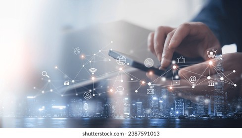 Social media marketing, global business, IoT Internet of Things concept. Woman using mobile phone for online shopping and digital banking via mobile app, e-commerce, multichannel marketing - Powered by Shutterstock