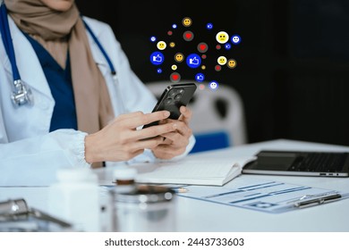 Social media and Marketing virtual icons screen of business women typing keyboard with laptop computer and smart phone at office. - Powered by Shutterstock