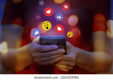  Social media, social network concept. Hands of woman post button love, heart, chat, emoji icon, chat typing on mobile phone                           