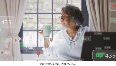 Social media notifications image over elderly woman drinking coffee by window. Technology, communication, digital, smartphone, internet, lifestyle - Powered by Shutterstock