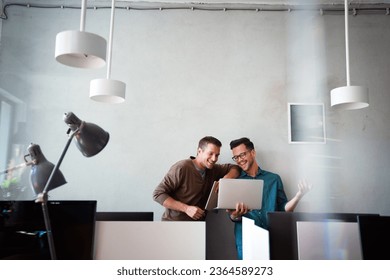 Social media, online, connect, technology concept. Startup. Happy business men working together - Shutterstock ID 2364589273