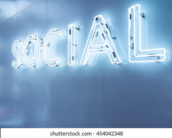 Social Media Type Font Neon Sign Light Blue Tone Signage On Wall In Perspective