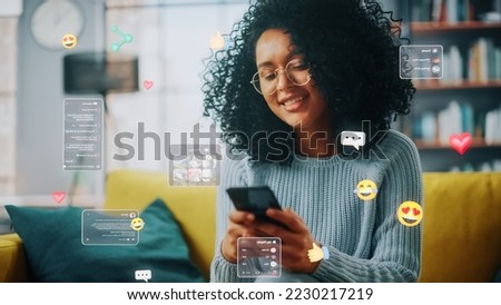Social Media Visualization Concept: Happy Black Woman Uses Smartphone at Home. 3D Representation of Social Media Posts, Smiley Faces, e-Commerce Online Shopping Digital Icons Flying Around the Device
