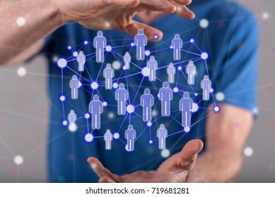 Social network concept between hands of a man in background