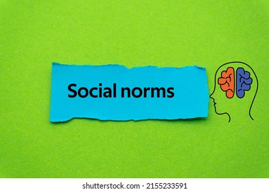 Social norms.The word is written on a slip of colored paper. Psychological terms, psychologic words, Spiritual terminology. psychiatric research. Mental Health Buzzwords.