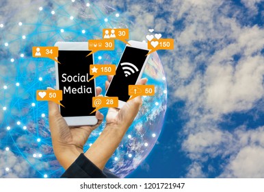 Social notification icon, smartphones in women's hands, globe and sky background, concept  ​​linking everything to internet with things (iot) Elements of this image furnished by NASA