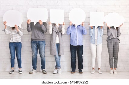 Social Opinion Concept. Group Of People Hiding Faces Behind Blank Speech Bubbles, Free Space