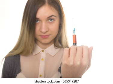 The Social Problem. Young Sad Woman Holding Syringe To Drug Use