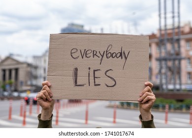 Social problems message. Everybody lies. responsibility. social problems reflections banners. Man holding conceptual sign. Guy with sign inspiration. Man is holding banner. parade protest - Shutterstock ID 1741017674