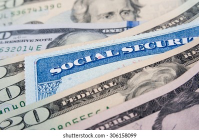 Social Security Card And American Money Dollar Bills Close Up Concept