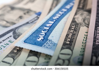 Social Security Card And American Money Dollar Bills Close Up Concept