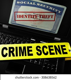 Social Security Card With Identity Theft Stamp On Laptop Screen With Crime Scene Tape 