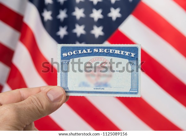 Social security card and resident alien card.\
Green card american dream\
concept