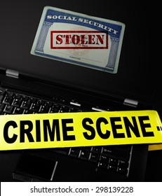 Social Security Card With Stolen Stamp On A Laptop With Crime Scene Tape -- Identity Theft Concept