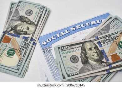 Social Security Card And Us Dollars Cash Money On White. Social Security Benefits. Concept Of Social Security Benefits Payment, Retirement And Federal Government Benefits