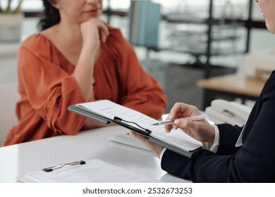 Social Worker Explaining Contract To Customer