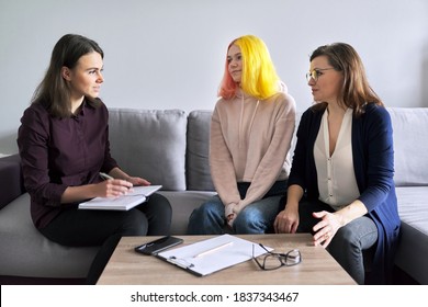 Social worker, psychologist, counselor at meeting with mature woman and her teenage daughter. Psychology, family mental health, adolescence problems, mother daughter child parent relationships