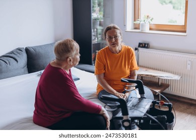 A social worker talks to a lonely old woman.Loneliness of elderly people - Powered by Shutterstock