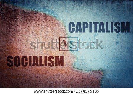 Socialism versus capitalism split concrete wall cracked in two different halves, red and blue side. Socialist centralized economic planning vs capitalist liberated free market. Future strategy choice.