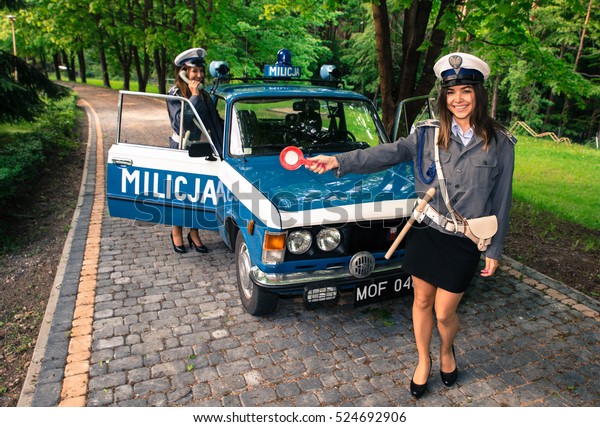 Socialist Militia\
patrol car and policewoman - Militia patrol car from the period of\
socialist Polish\
exhibition,