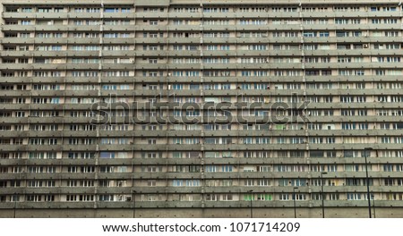 Socialist-era housing in Katowice, Poland. View of numerous windows in multistory residential block house