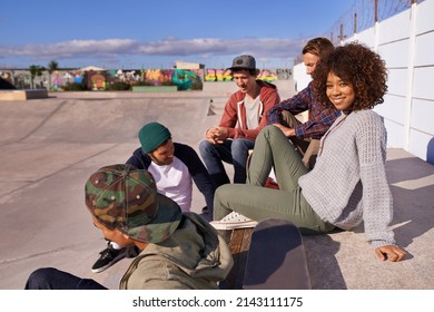 Socializing At The Skatepark. Shot Of A Group Of Friends Socializing At The Skatepark.