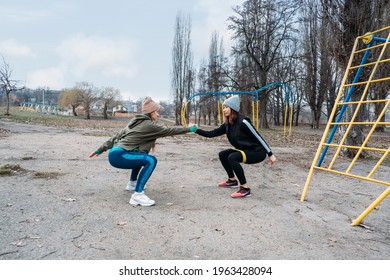 Socially distant bootcamps. Group fitness workout classes outdoors. Group Workout Classes in public parks. Three women training together in the public park. Health, wellness and community concept - Powered by Shutterstock