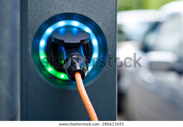 Socket for electrical car battery\
charger with load indicator lights, selective\
focus\
\

