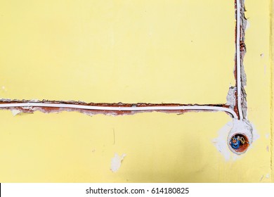 Socket And Electrical Wires On The Wall, Home Renovation Concept