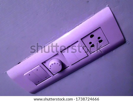 Socket with four switches anti parallel to each other and with connected ceiling fan adjustor