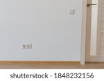 socket on a light wall in a stylish apartment	