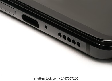 socket in the phone under a usb-c cable. with screw holes for speakers.