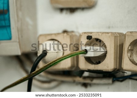 The socket stop plug looks dull, with a cable sticking out