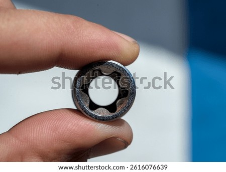 Socket wrench in human hand