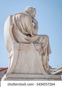 Socrates the ancient Greek philosopher marble statue, under clear blue sky, Athens Greece