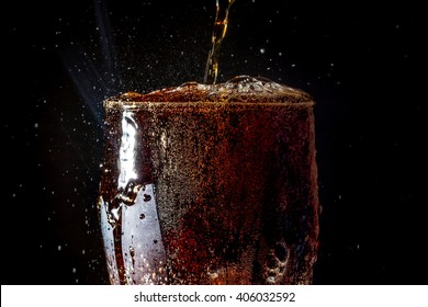 Soda Large Glass, Overflowing Glass Of Soda Closeup With Bubbles Isolated On Black Background