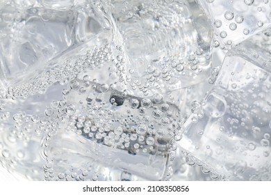 Soda Water With Ice As Background, Closeup