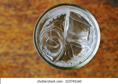 Soda With Water And Ice In The Glass Cup; Top View