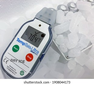 Sodertalje, Sweden - Jan 2021: Electronic Temperature Sensor And Recorder On Dry Ice Showing Very Low Value Of Minus 70 Celsius Degrees In Container For Transport Of Frozen Vials. Selected Focus.