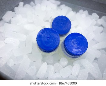 Sodertalje-Sweden - December 2020: Three Vials With Blue Screw Caps On Dry Ice, Surrounded By Mist Of Sublimating Dry Ice, Prepared For Transport In Professional, Styrofoam Container. Selected Focus.