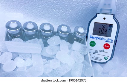 Sodertalje-Sweden - January 2021: Glass Vials On Dry Ice And Electronic Temperature Recorder At Very Low Temperature Of Minus 70 Celsius Degrees In A Styrofoam Container. Selected Focus.